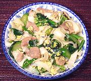 Dish of Cambodian Pork with Broccoli and Rice Noodles